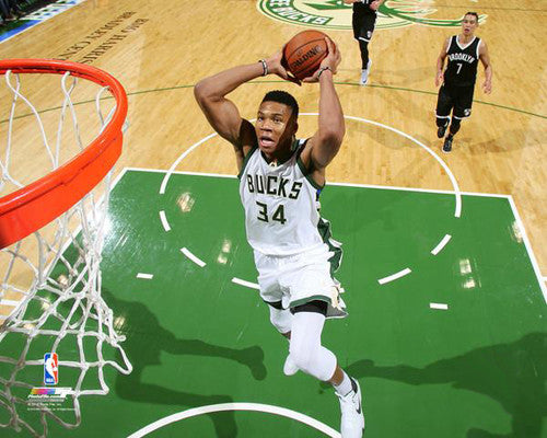 Giannis Antetokounmpo with A crazy poster dunk on John Collins