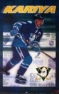 NHL99: Paul Kariya, dog on his chest, feet in water, is content