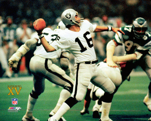 Oakland Raiders quarterback Jim Plunkett (16) hands off to running